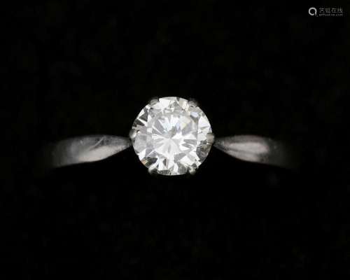 A 14 karat white gold solitaire ring, set with approx. 0.80c...