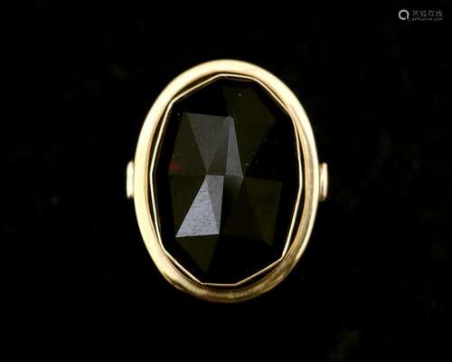 A 14 karat gold ring with garnet