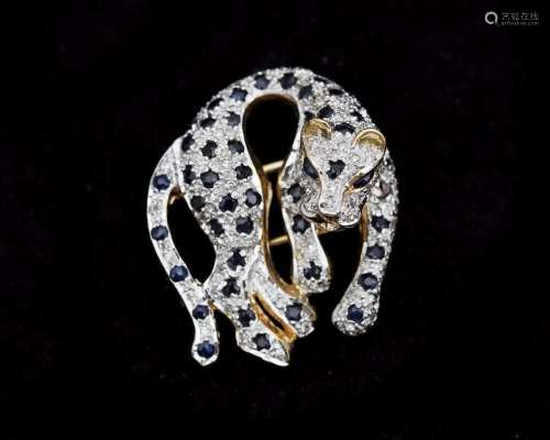 A 14 karat gold panther brooch pavé set with diamonds and sa...