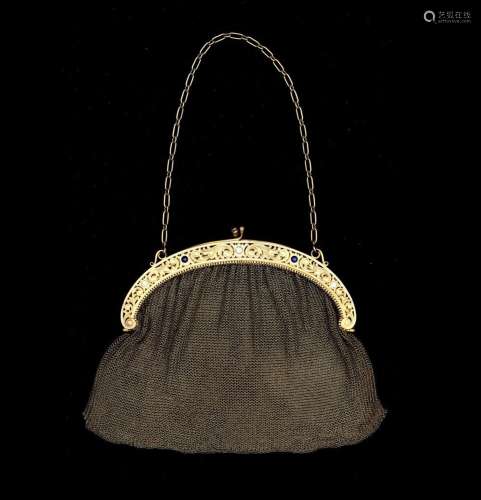 A 14 karat gold bag and wallet, set with diamonds and sapphi...