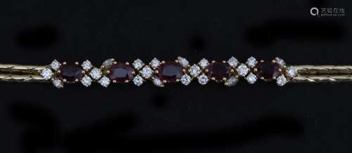 An 18 karat gold bracelet set with rubies diamonds