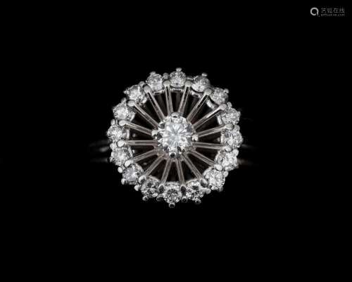 An 18 karat. white gold entourage ring set with a diamonds o...