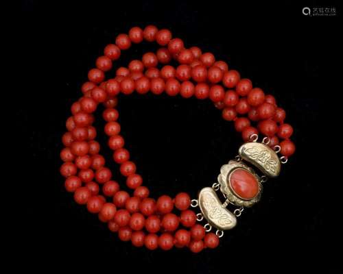 A red coral bracelet on 14 karat gold lock with side pieces