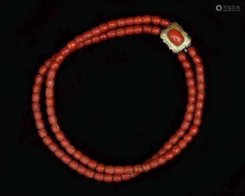 A two-piece red coral necklace on 14 karat gold clasp