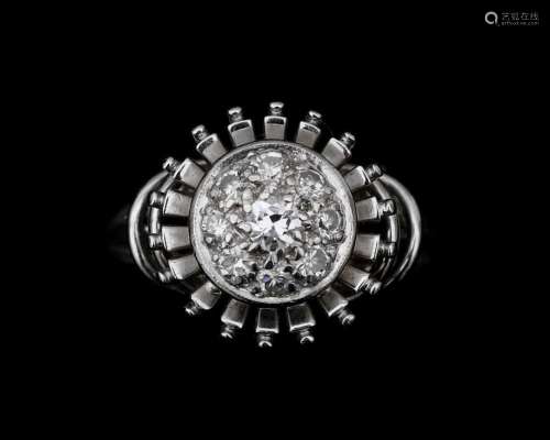 A 18 karat white gold rosette ring set with nine individuall...