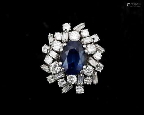 An 18 karat white gold cocktail ring, set with sapphire and ...