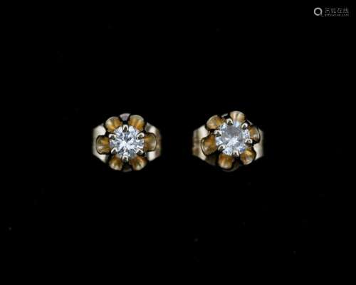 A pair of 14 karat. gold ear studs set with diamonds approx....