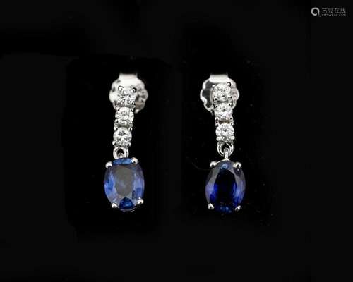 A pair of 18 karat white gold earrings set with diamonds and...