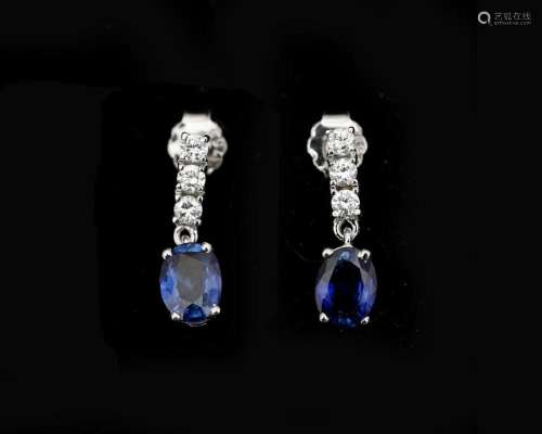 A pair of 18 karat white gold earrings set with diamonds and...