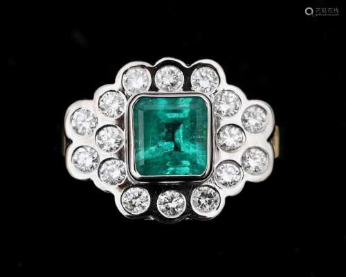 A 14 karat bicolor applique ring, set with diamonds and emer...