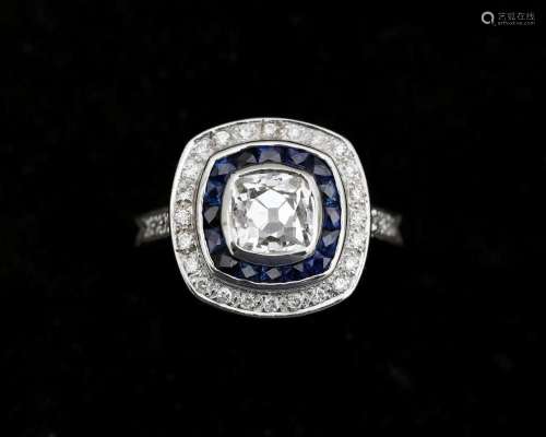 A 14 karat white gold ring set with a cushion/Bolshevik cut ...