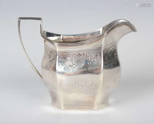 A George III silver octagonal cream jug with reeded rim abov...