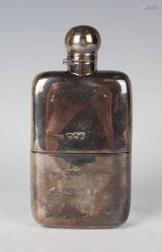 A late Victorian silver hip flask with screw hinged lid and ...
