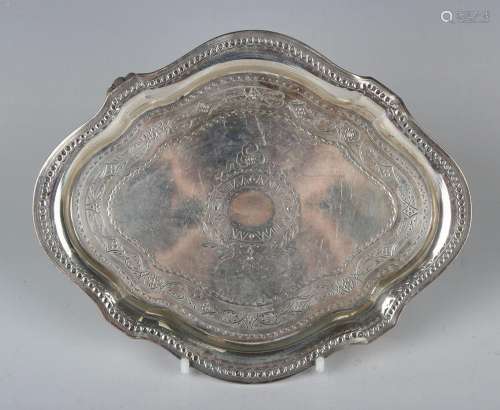 A Victorian silver teapot stand of lobed oval form with engr...