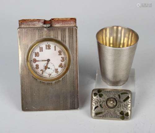 A George V silver mounted leather bedside timepiece with eng...