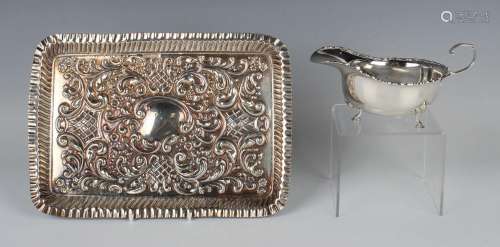 An Edwardian silver rectangular dressing table tray, embosse...