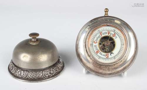 An Edwardian silver mounted circular desk bell, the base emb...