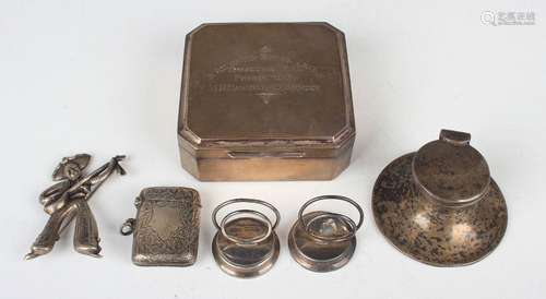 A small group of silver items, including a canted corner squ...