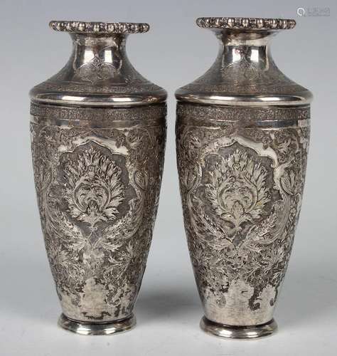 A pair of 20th century Persian white metal posy vases, each ...