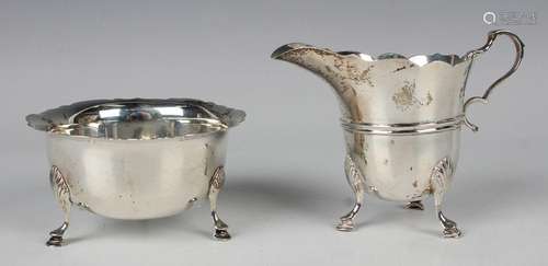 A late Victorian silver milk jug and matching sugar bowl, ea...