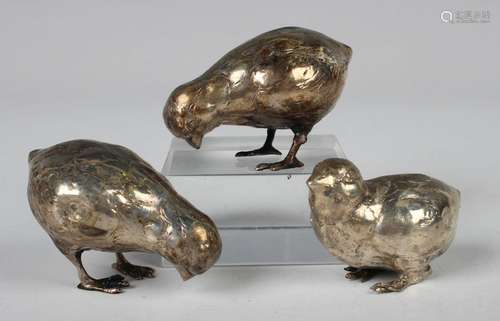 Three Continental white metal models of chicks with engraved...