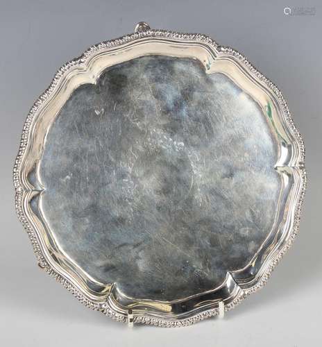 A George III silver circular card salver, the centre engrave...