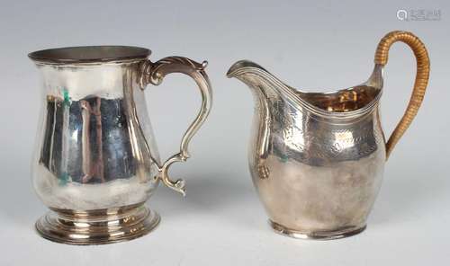 A George III silver baluster christening tankard with foliat...