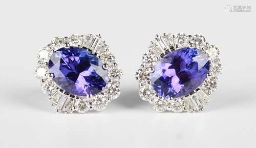 A pair of white gold, tanzanite and diamond cluster earrings...