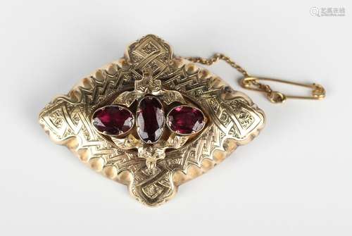 A Victorian garnet brooch, mounted with three oval cut garne...