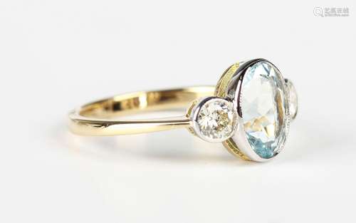 A gold ring, collet set with an oval cut aquamarine between ...