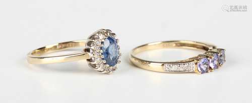 A 9ct gold, sapphire and diamond oval cluster ring, claw set...