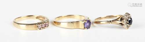 A 9ct gold, oval cut sapphire and diamond cluster ring, ring...