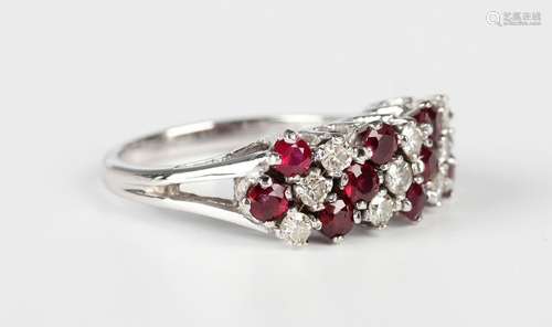 A white gold, ruby and diamond ring in a slanting design, cl...