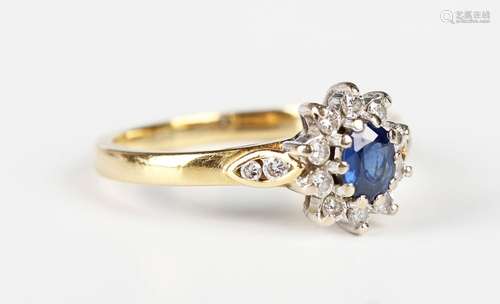 An 18ct gold, sapphire and diamond oval cluster ring, claw s...