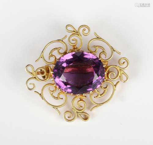 A gold and amethyst single stone brooch, claw set with the o...