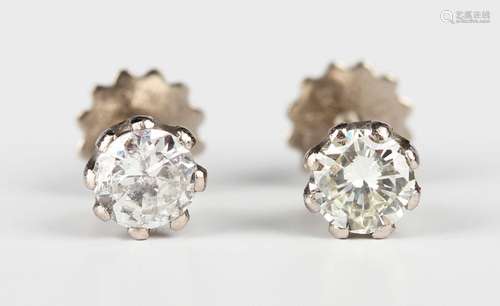 A pair of white gold and diamond single stone earstuds, each...