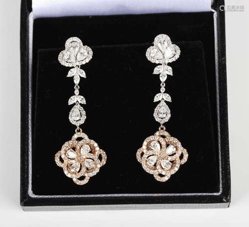 A pair of two colour gold and diamond pendant earrings, each...