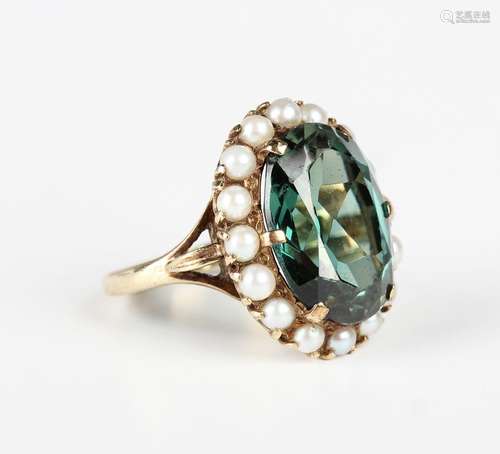 A 9ct gold, synthetic green spinel and cultured pearl oval c...