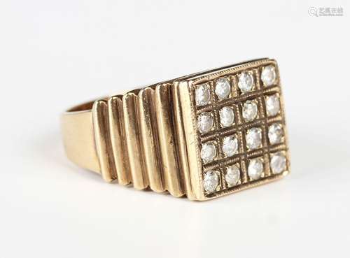 A gold and diamond square cluster ring, mounted with sixteen...