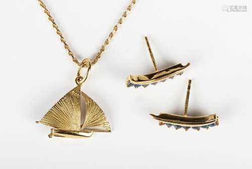 A gold pendant, designed as a yacht, detailed '18ct', weight...