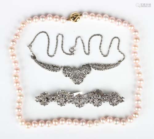 A single row necklace of uniform light pink tinted cultured ...