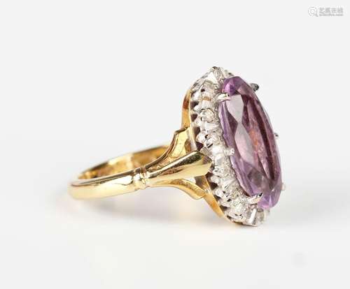 An 18ct gold, amethyst and diamond oval cluster ring, claw s...