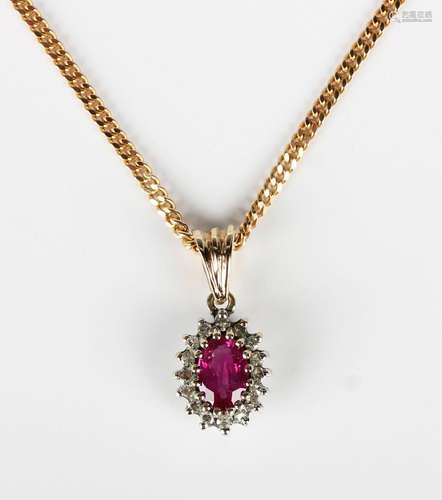 A 9ct gold, ruby and diamond oval cluster pendant, length 1....