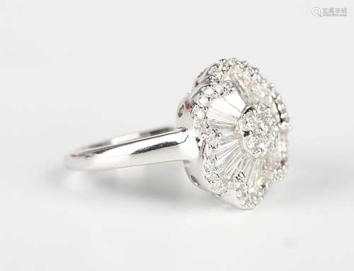 An 18ct white gold and diamond cluster ring in a flowerhead ...