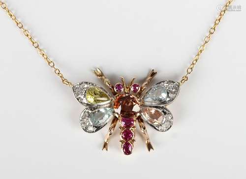 A gold and varicoloured gem set pendant necklace, the front ...