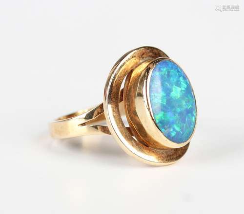 A gold ring, mounted with an oval opal doublet, detailed '14...