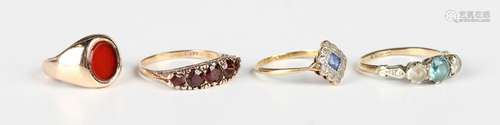 A 9ct gold and garnet five stone ring, mounted with a row of...