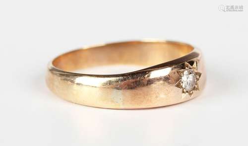 A gold and diamond single stone ring, star gypsy set with a ...