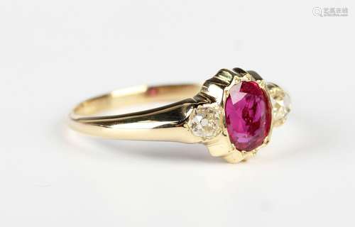 A gold, ruby and diamond ring, mounted with the oval cut rub...