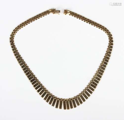 A gold necklace, the front in a graduated bar link design wi...